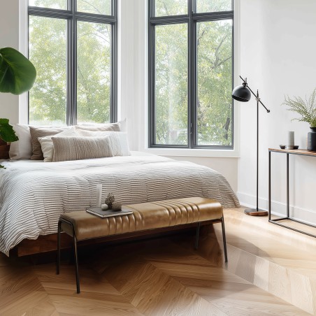 Banc matelassé en cuir marron et pieds acier